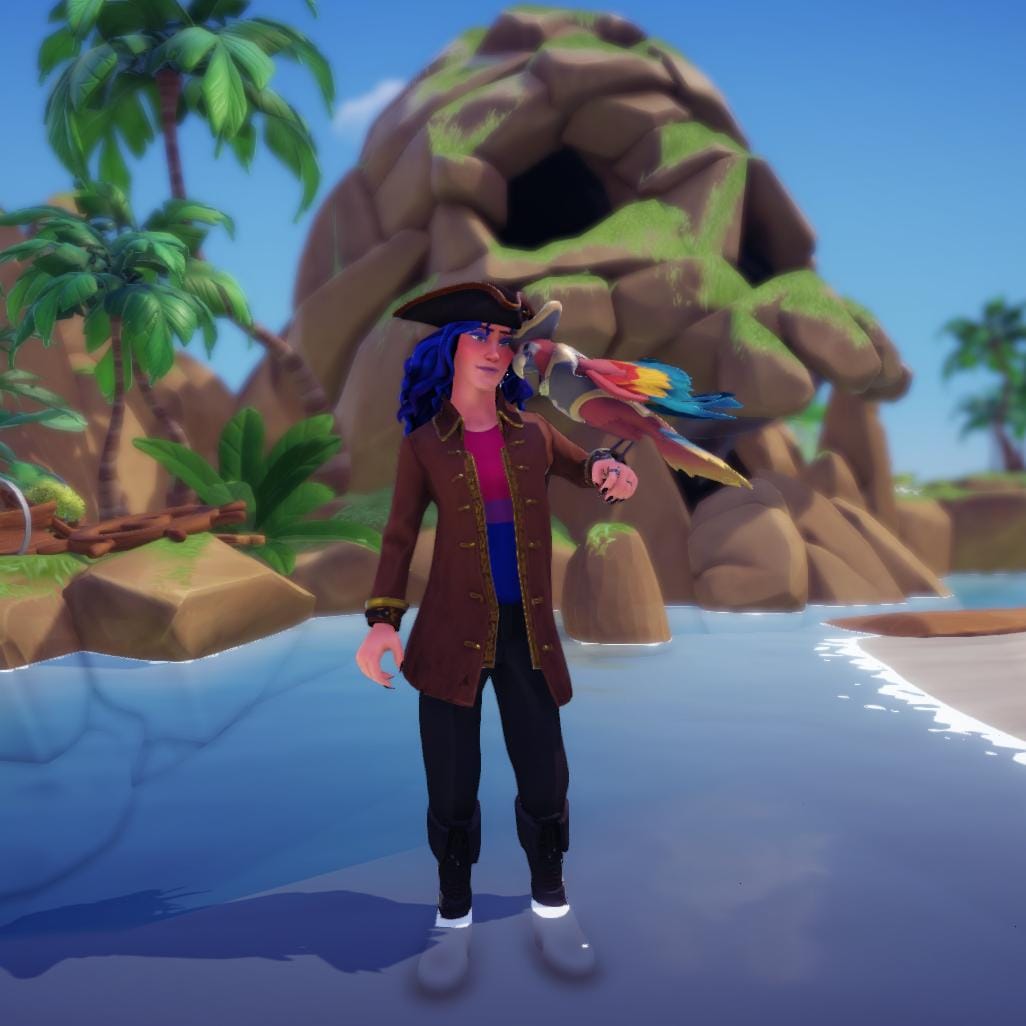 The player character dressed as a pirate with a bisexual flag shirt under his long coat. He has his forehead against that of the parrot that is perched on his wrist. They are standing in the shallow sea in front of Skull Rock.