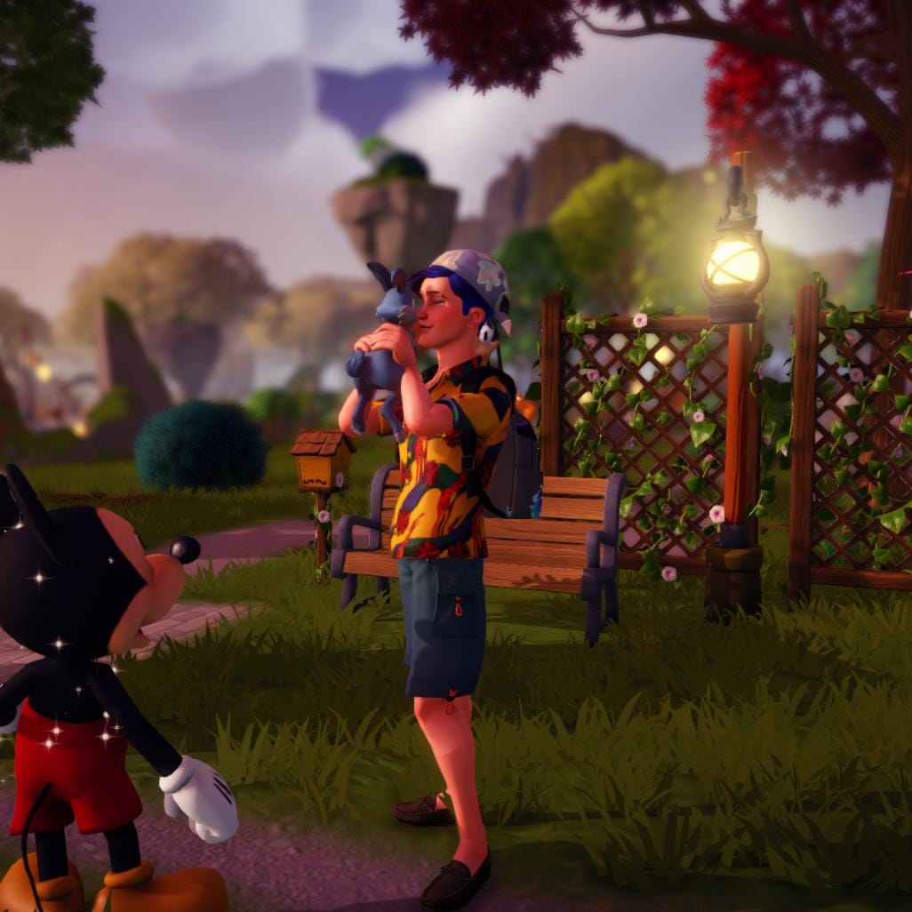 The player character is standing in the Peaceful Medow, holding a light blue bunny up to his face and nuzzling it while smiling. Mickey is standing to the side, looking up at them, smiling as well.
