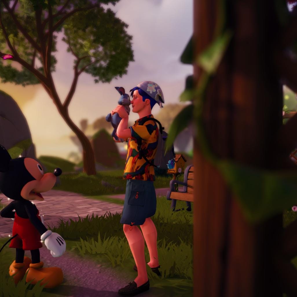 Different angle of the player character standing in the Peaceful Medow, holding a light blue bunny up to his face and nuzzling it while smiling.