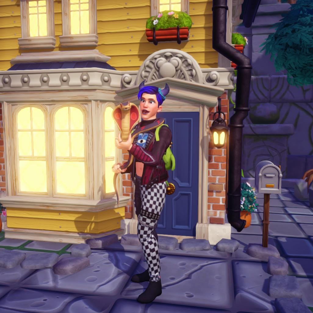 The player character looking excited and happy as he is holding his snake companion in his arms. They are facing the camera and the snake is smiling cutely.